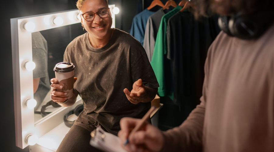 young adults sharing clothes at swap party
